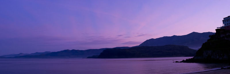 Scenic view of sea against romantic sky at sunset