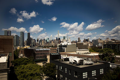 Buildings in city against sky