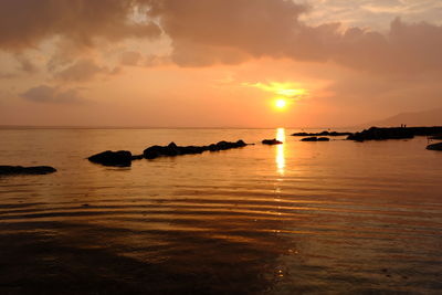 Scenic view of sea against sky during sunset