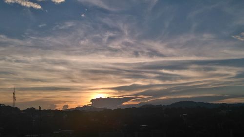 Silhouette landscape against sunset