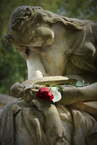 Close-up of statue against cloudy sky