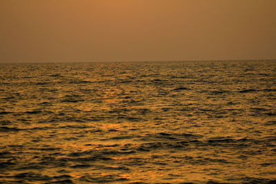 Scenic view of sea against clear sky during sunset