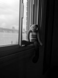 Toy car on window sill at home