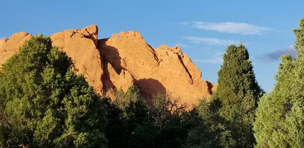 Low angle view of rock formation against sky