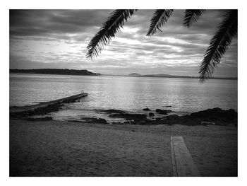 Scenic view of sea against cloudy sky