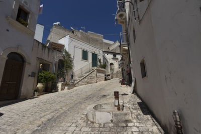 Narrow alley amidst buildings in scicli