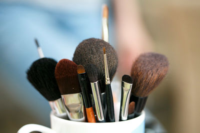 Close-u-p of make-up brushes in container