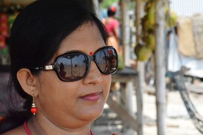 Close-up of woman wearing sunglasses