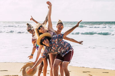 Group of cheerful people on beach