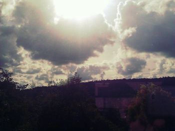 Scenic view of landscape against cloudy sky