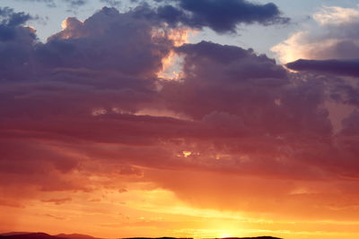 Low angle view of dramatic sky during sunset