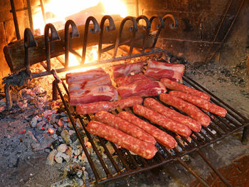 High angle view of meat on barbecue grill