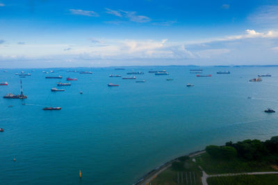 High angle view of sailboats in sea against sky