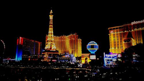 Low angle view of illuminated ferris wheel