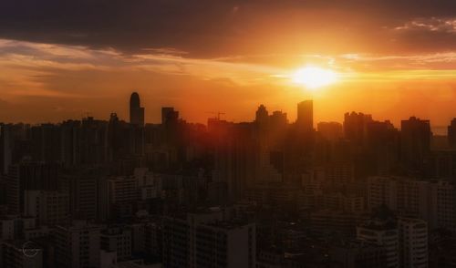 Cityscape against sky during sunset