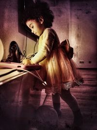 Woman sitting on wall at home