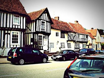 Cars parked in front of house