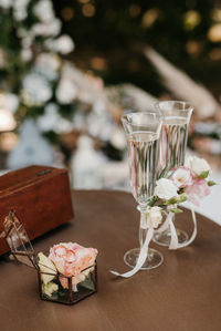 Close-up of wine glasses on table