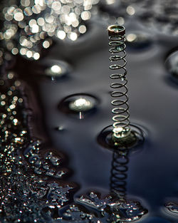 Close-up of illuminated lighting equipment on glass table