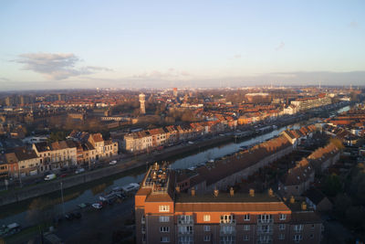 High angle view of buildings in city against sky