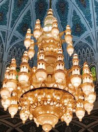 Low angle view of illuminated chandelier in building