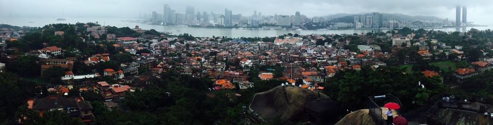 Panoramic view of cityscape against sky