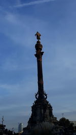 Low angle view of statue against sky