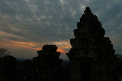 Low angle view of old ruin against sky during sunset