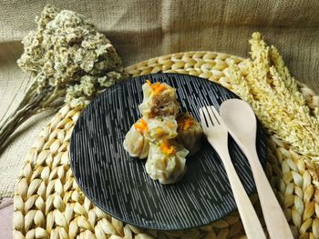 A plate of dimsum, pretty popular chineese food. in indonesia we call it dimsum siomay. 