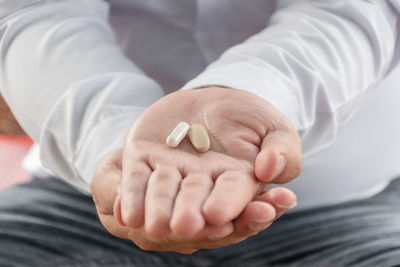 Close-up of man holding hands