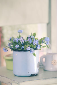 Close-up of white flower vase on table