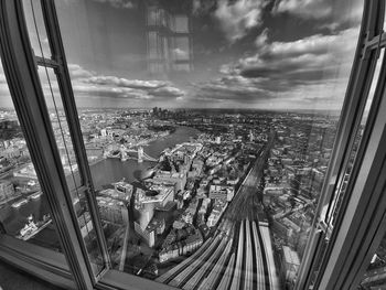 Panoramic view of cityscape seen through window