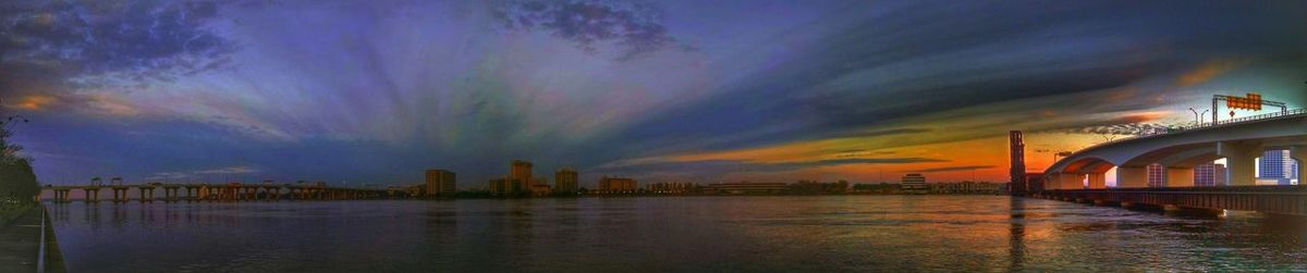 Built structure in water at sunset