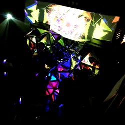 Low angle view of firework display at night