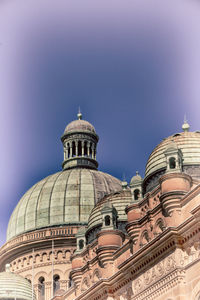 Low angle view of a building against blue sky