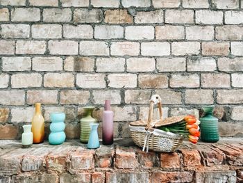 Wicker basket on stone wall