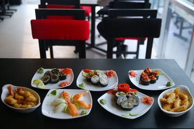 High angle view of sushi served on table in restaurant