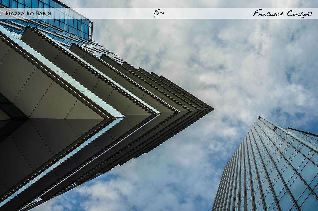 LOW ANGLE VIEW OF MODERN OFFICE BUILDING AGAINST SKY