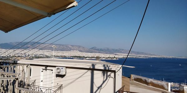 Bridge over sea against clear sky