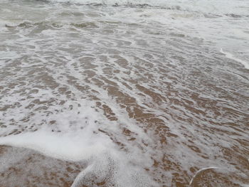 High angle view of waves on beach