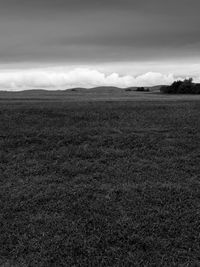 Scenic view of landscape against cloudy sky