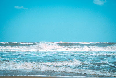 Scenic view of sea against clear blue sky