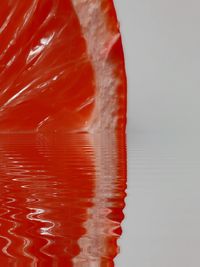 Close-up of red water in background