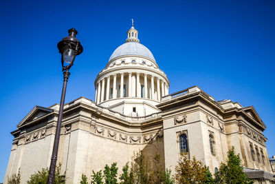 Low angle view of building against clear blue sky