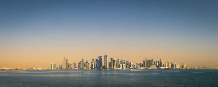 View of the doha cityscape at sunrise in october