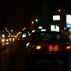 Illuminated train at night