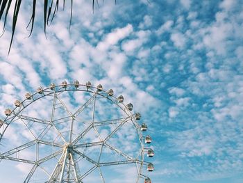 Low angle view of ferris wheel against sky