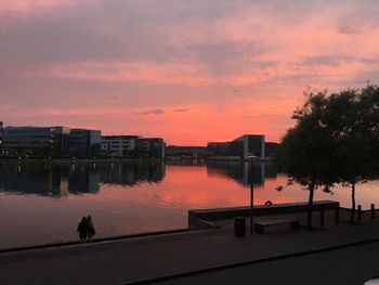 Reflection of buildings in calm lake