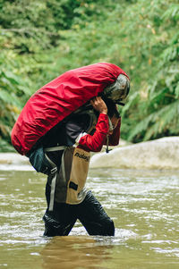 Full length of person standing in lake