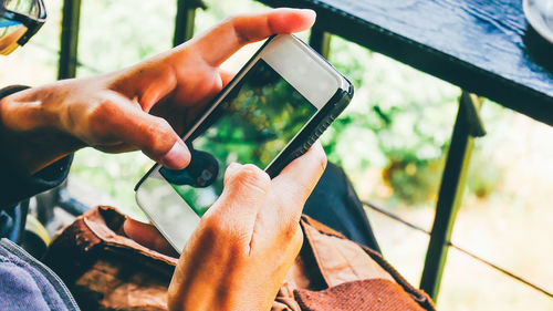 Close-up of man using mobile phone